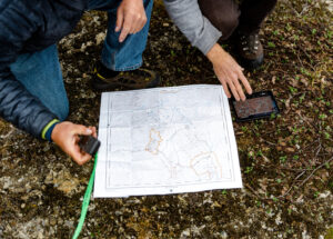 ID hands hover over map